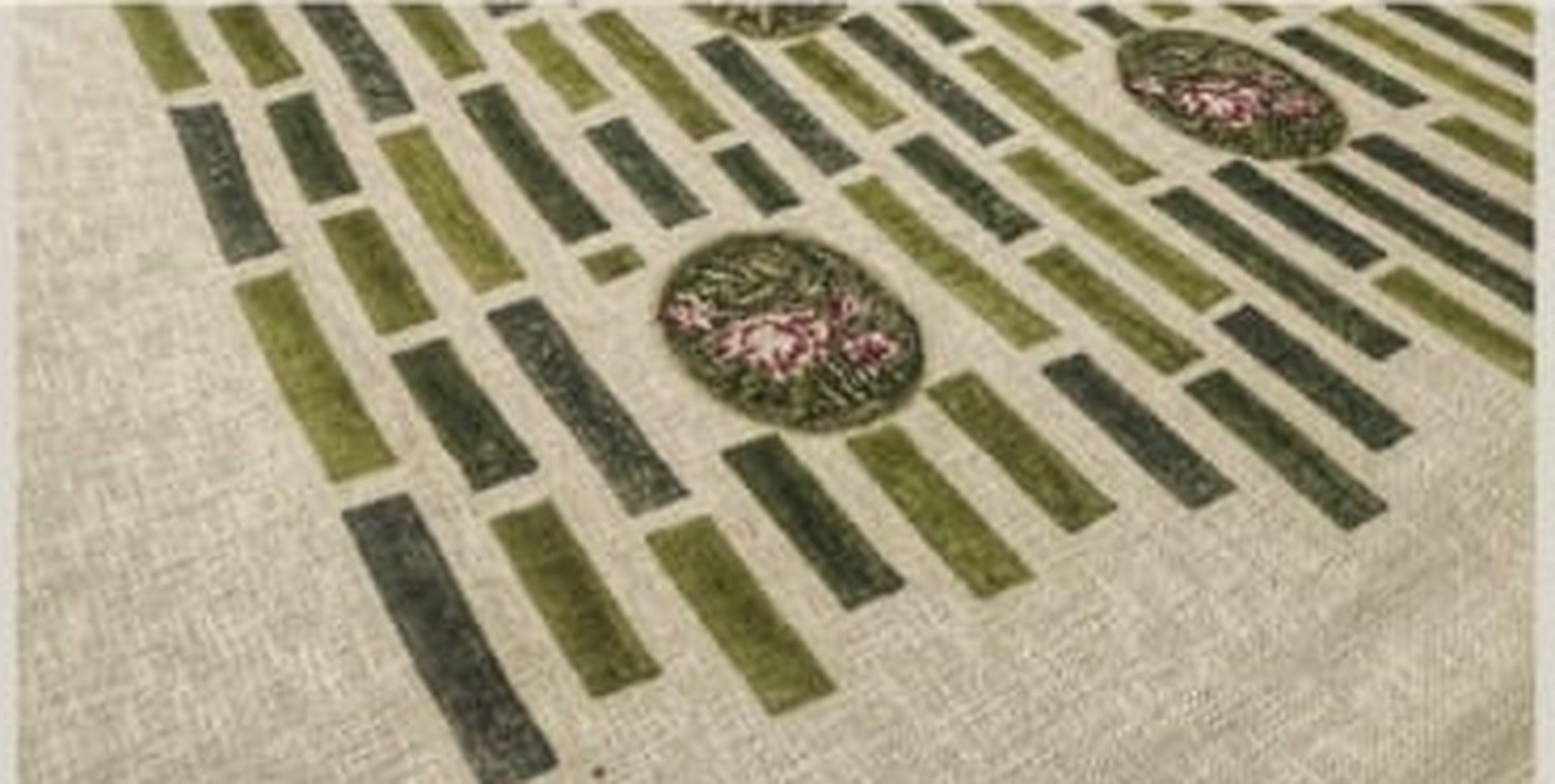 Hand-printed textile pattern with repeated bands and circular motifs